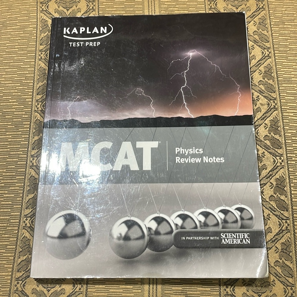 MCAT book with a little bit of writing